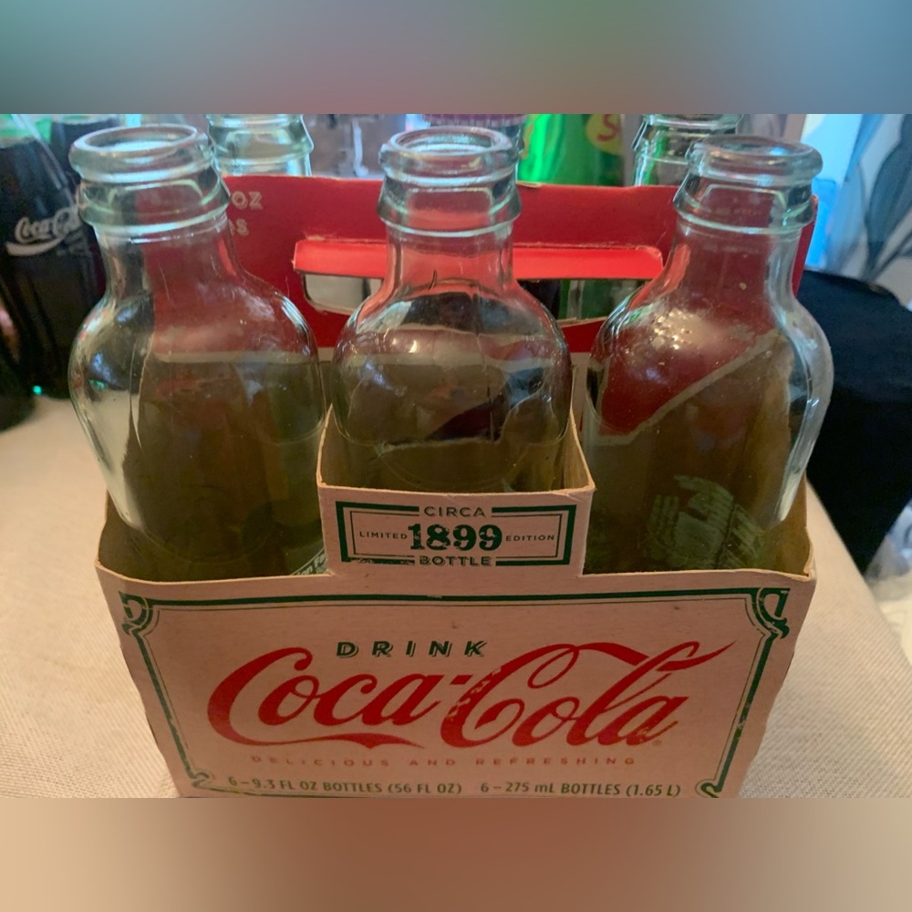 Coca-Cola Circa 1899 Edition Bottles with Red and Green Accents